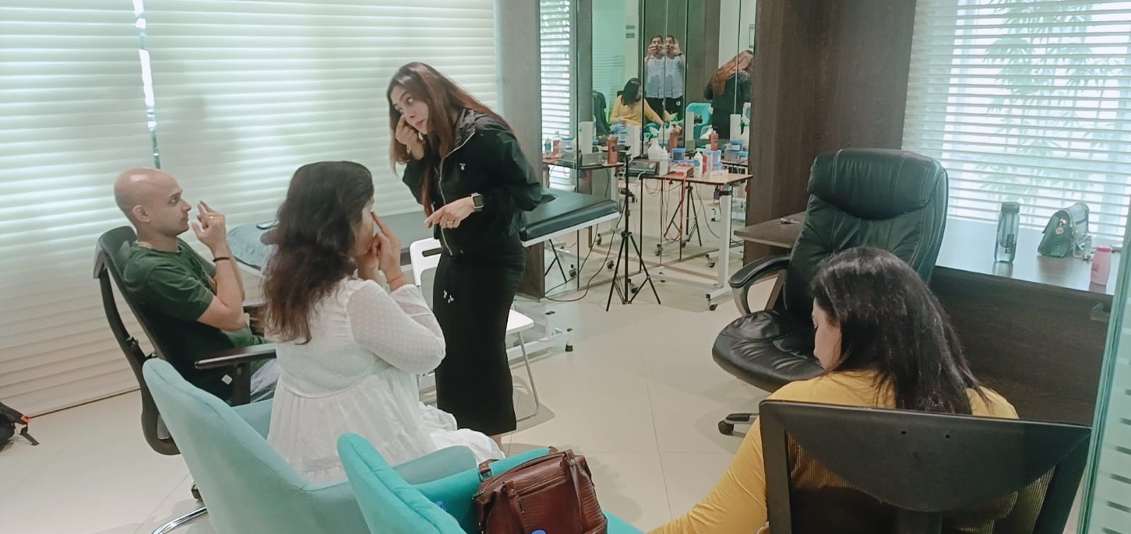 Vibha Jain explaining a relaxation exercise to a small group of participants seated in a consulting room in Mumbai